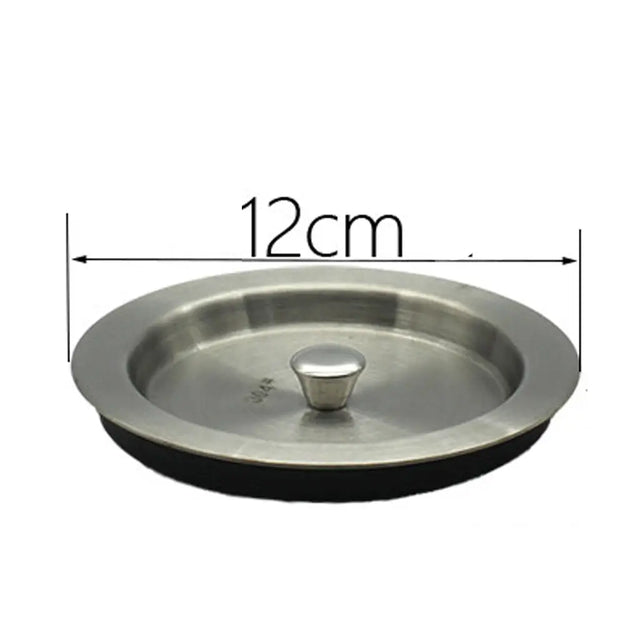 Stainless steel lid with measurement label on a white background