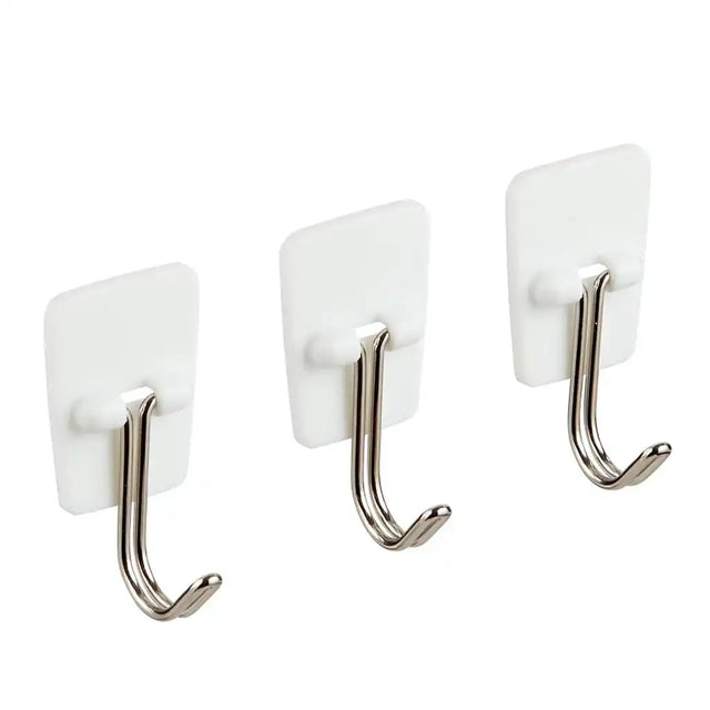 Three white hooks with metal hooks on a white background