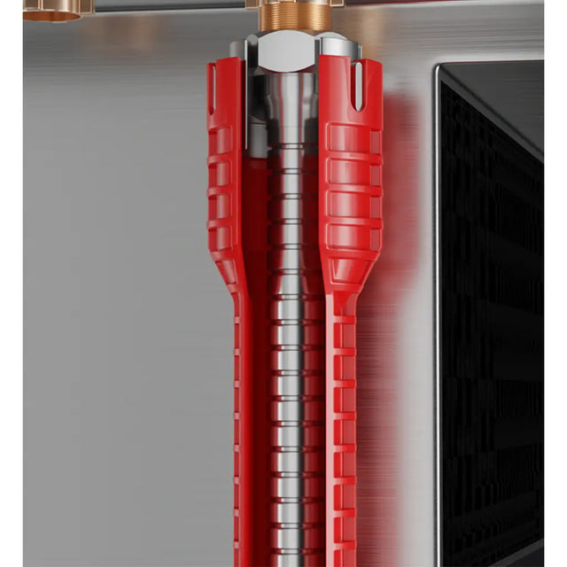 Close-up of a red and silver kitchen appliance component, likely a vent or filter assembly, shown against a brushed metal background.