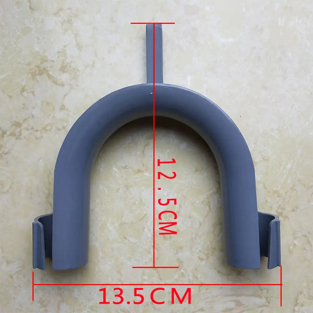 Gray U-shaped plastic clip with measurements on a beige background