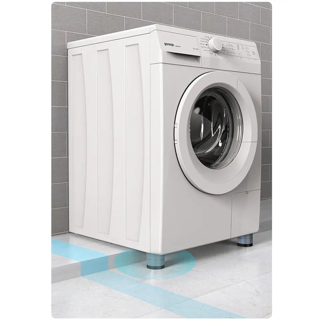 White washing machine on a gray tiled floor