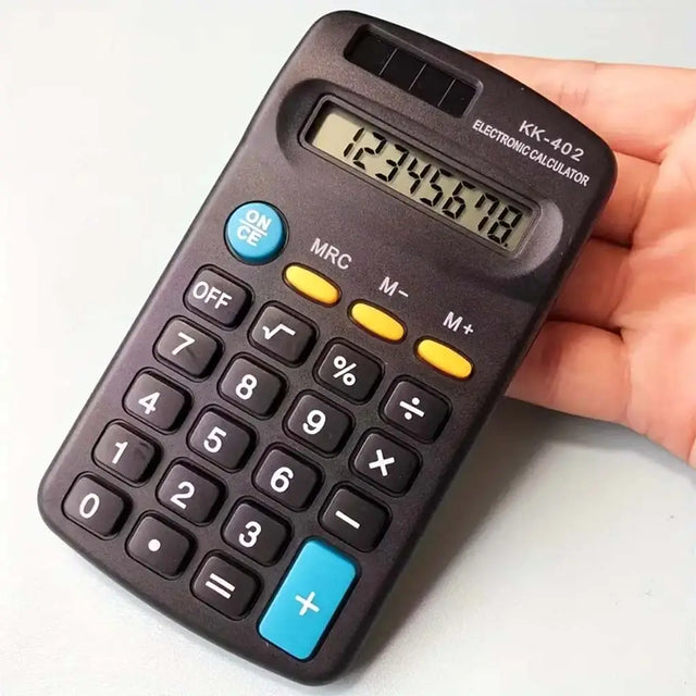 Hand holding a small calculator with a white background