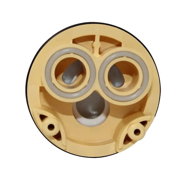 Mechanical component with beige casing and gray inner parts on a white background