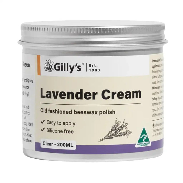 A 200ml jar of Gilly's Lavender Cream, an old-fashioned beeswax polish. The product is in a white plastic jar with a silver metal screw-on lid, featuring a cream-colored label with purple and orange accents, and a lavender flower illustration.