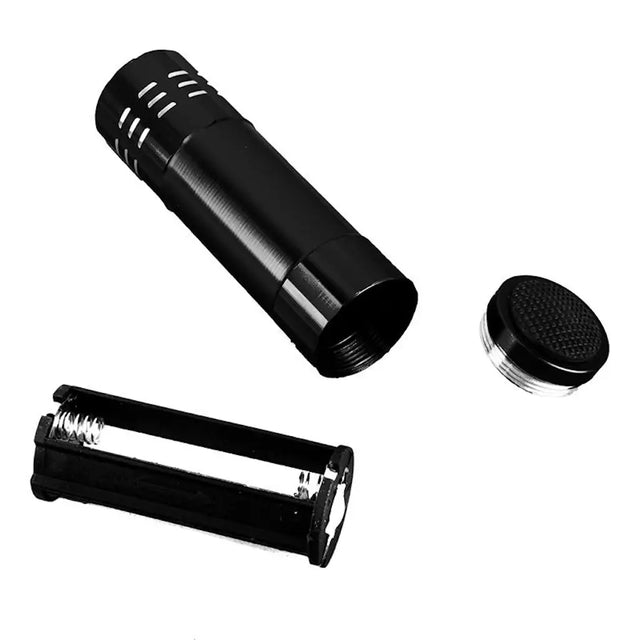 Black metal canister with a lid and a cylindrical component on a white background