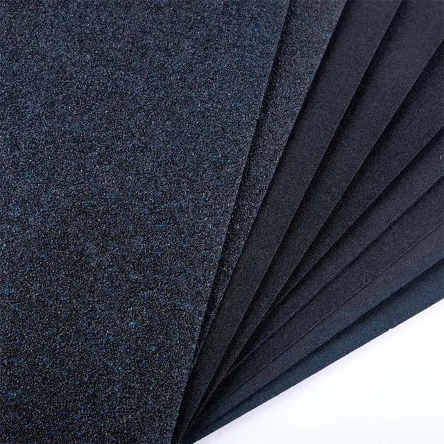 Stack of dark blue felt sheets on a white background