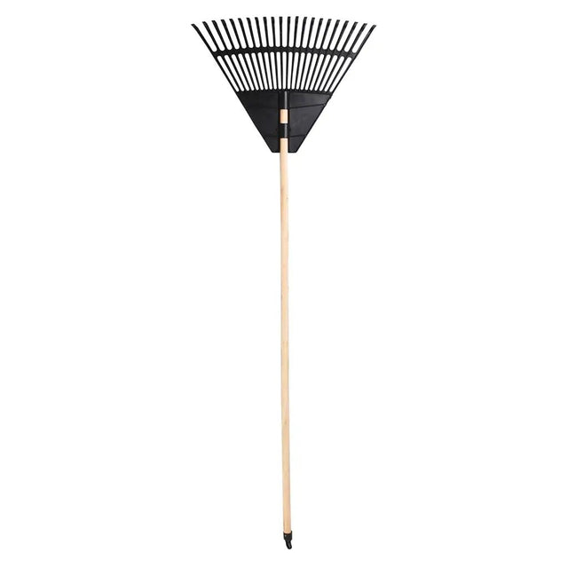 Garden rake with black metal head and wooden handle on a white background