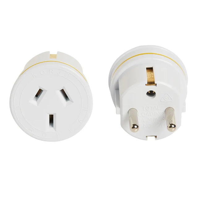Two white travel plugs on a white background