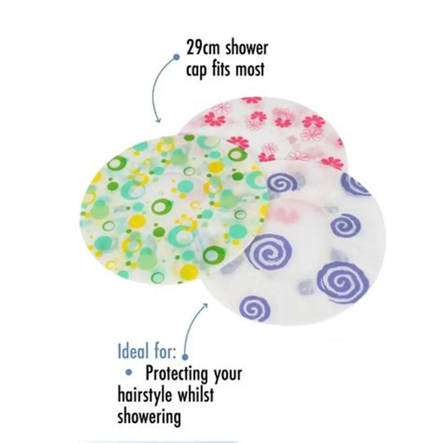 Three colorful shower caps with floral and spiral patterns on a white background.