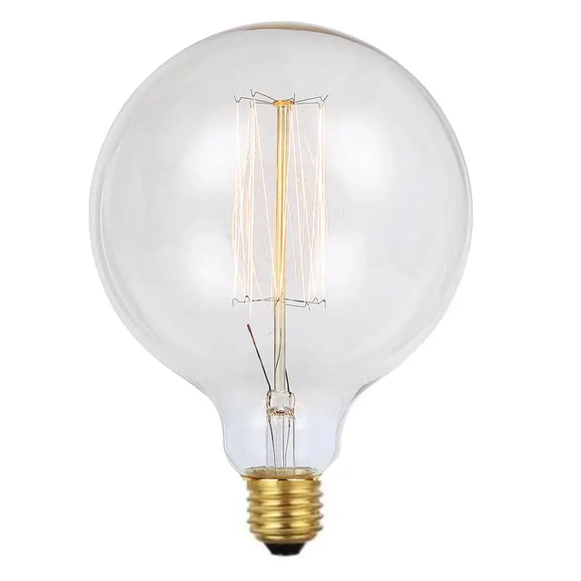 Clear light bulb with visible filament on a white background