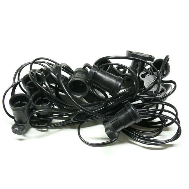 Pile of black plastic connectors on a white background