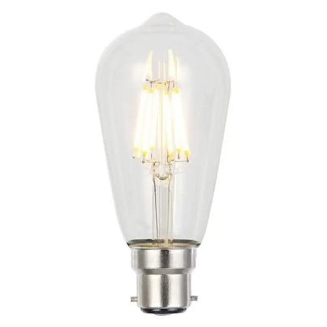 Clear light bulb with visible filament on a white background