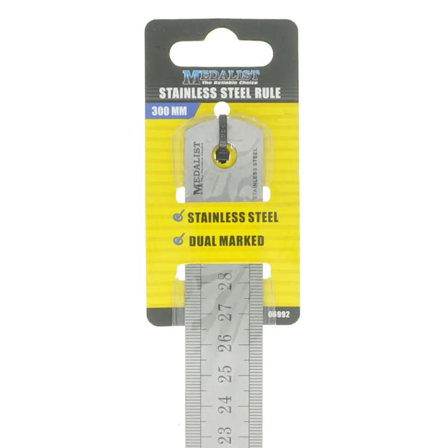 Metal ruler with 'Medalist' branding on a yellow and black packaging