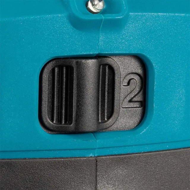 Close-up of a teal and black plastic switch or dial with the number 2 embossed on the side.