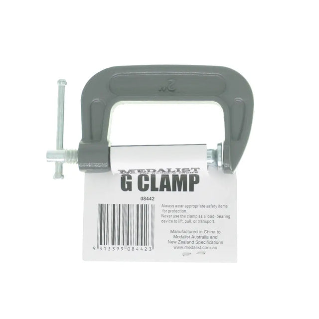 G clamp with a label on a white background