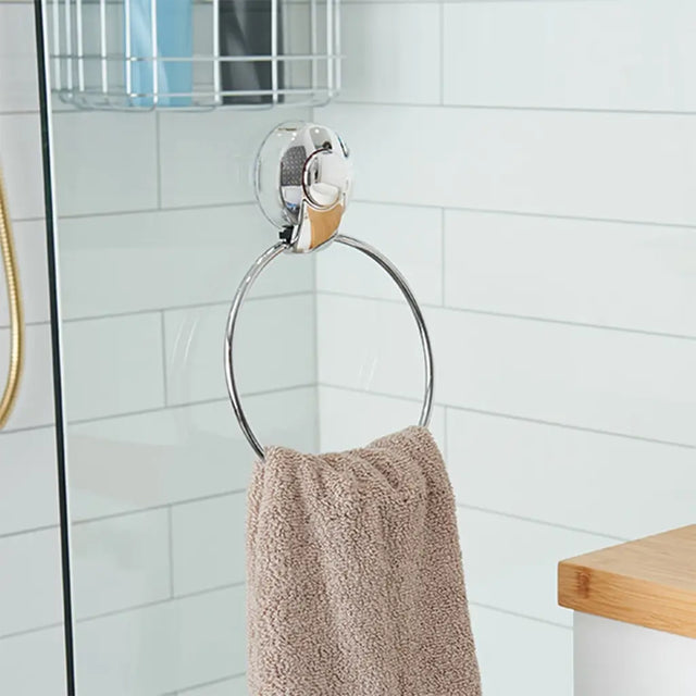 Towel ring with a towel hanging on it in a bathroom setting
