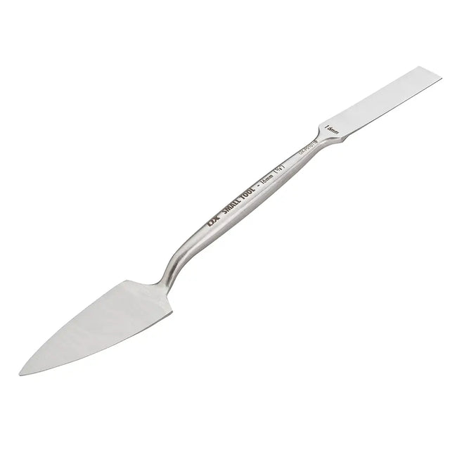 Metal spatula on a white background