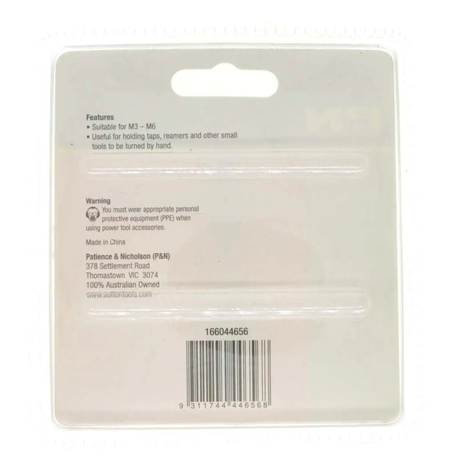 Back of a packaging card with text and a barcode on a white background