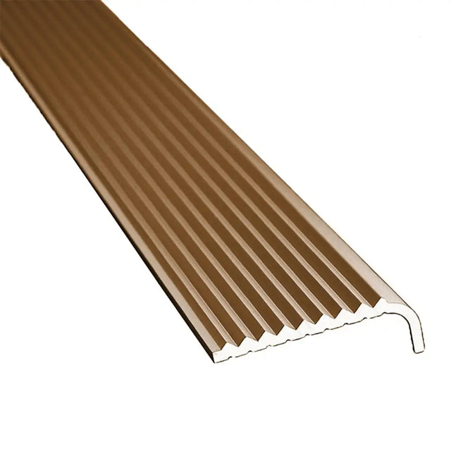 Brown plastic strip with ribbed texture on a white background