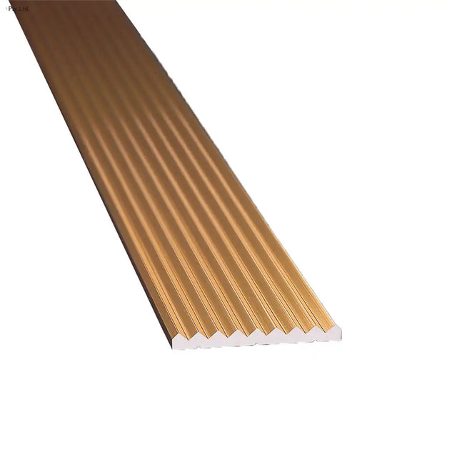 Gold-colored metal strip with white base on a white background