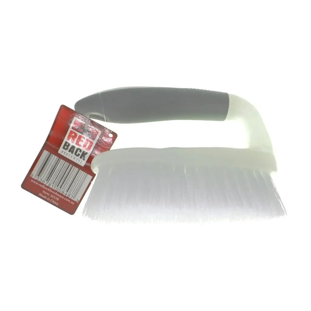 White brush with a red and white label on a white background