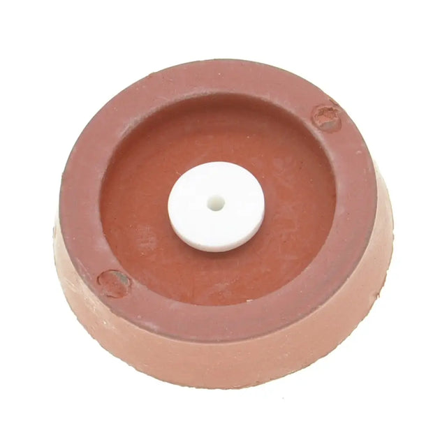 Round ceramic disc with a white center on a white background