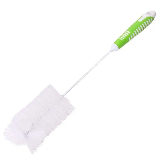 Cleaning brush with a green handle on a white background