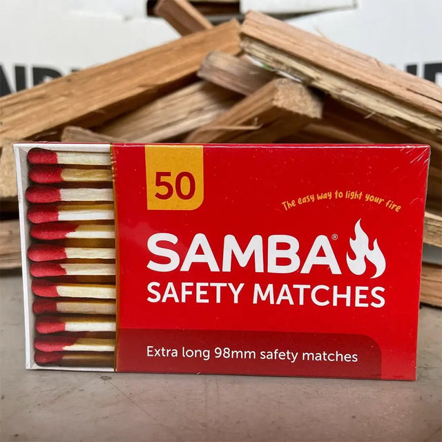 Box of Samba safety matches with matches sticking out on a wooden surface.