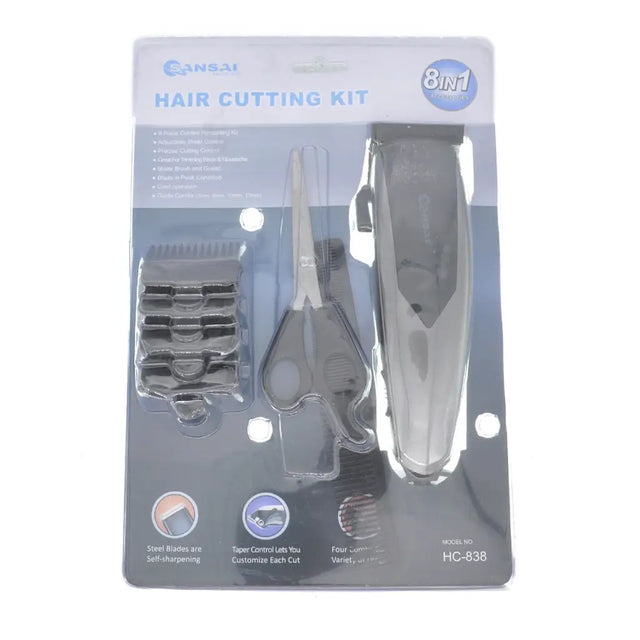 Hair cutting kit packaging with scissors, clippers, and attachments on a white background