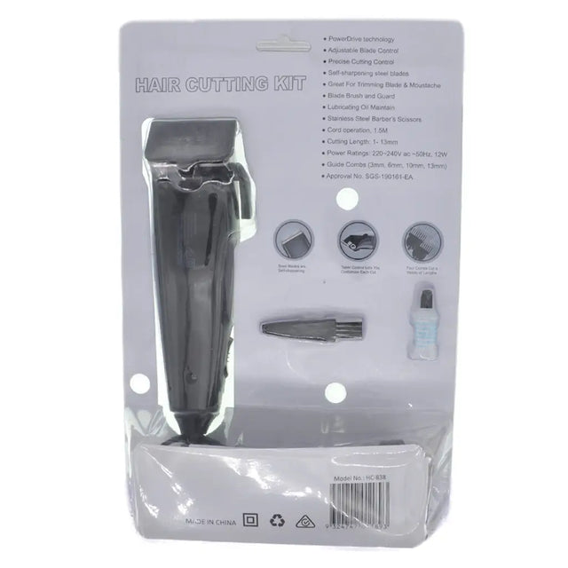 Hair cutting kit packaging with a black hair clipper on a white background