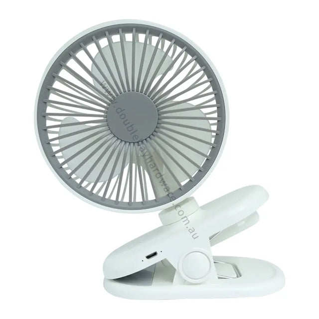 Portable fan with a clip on a white background