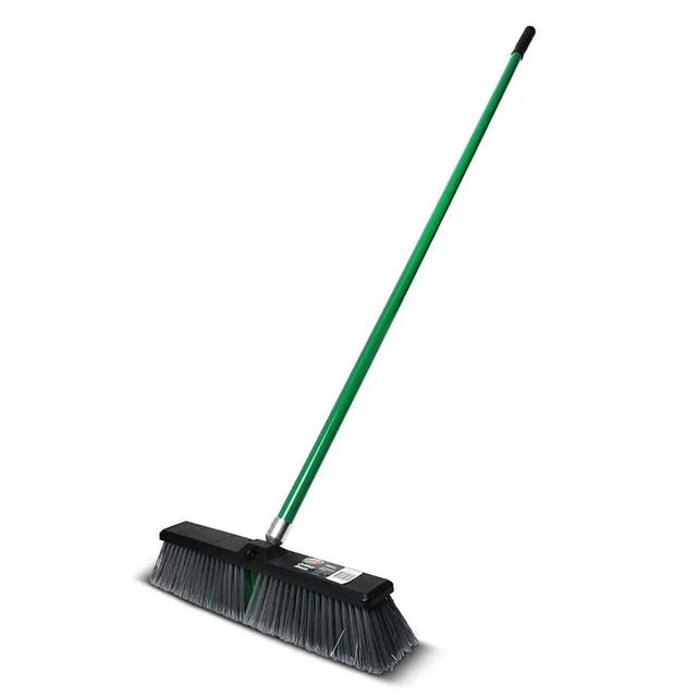 Green push broom with black bristles on a white background
