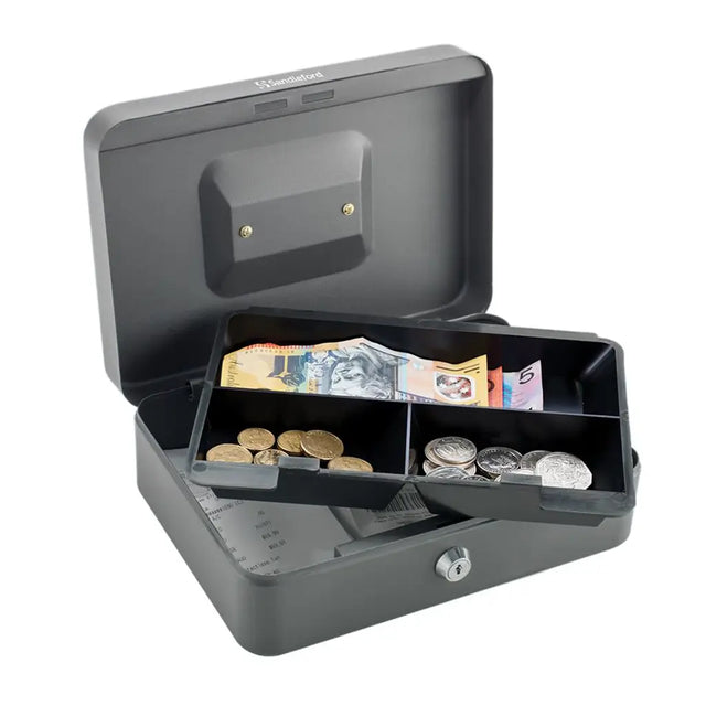 Gray cash box with money and coins on a white background