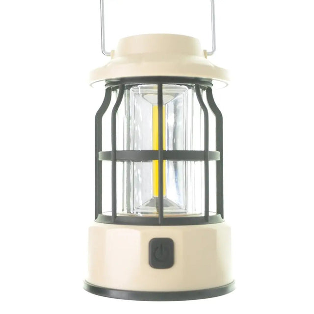 Beige camping lantern with clear glass cover on a white background