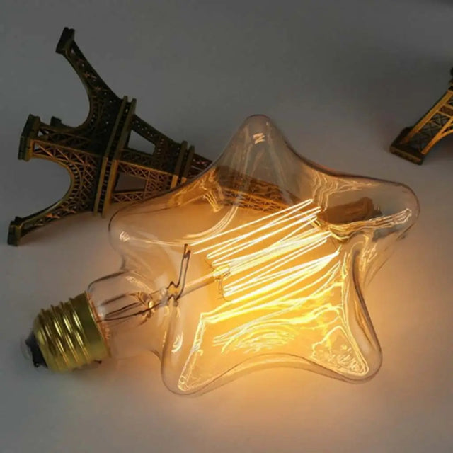 Star-shaped light bulb with Eiffel Tower model in the background