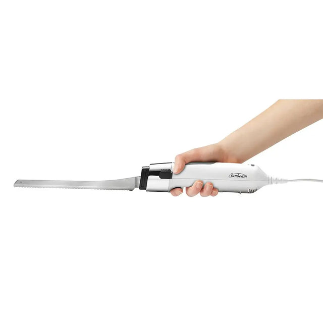 Hand holding a white hair straightener on a white background