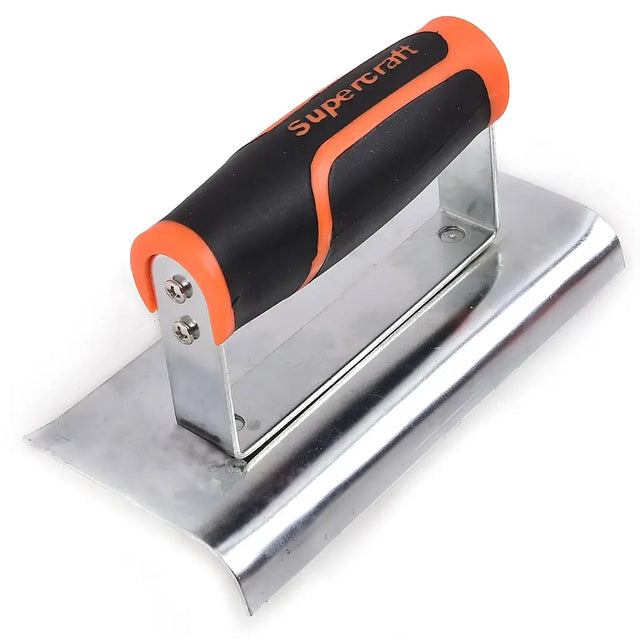 Metal trowel with black and orange handle on a white background