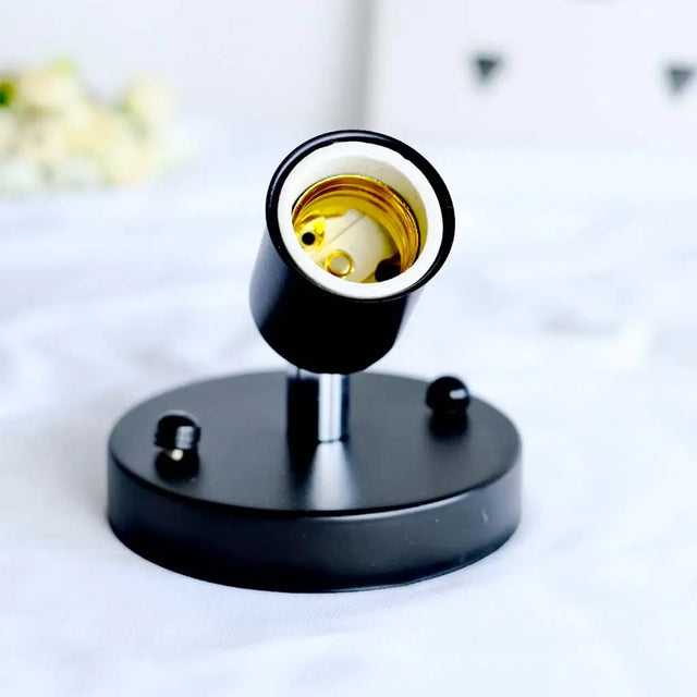 Black lamp holder with a light bulb on a white background