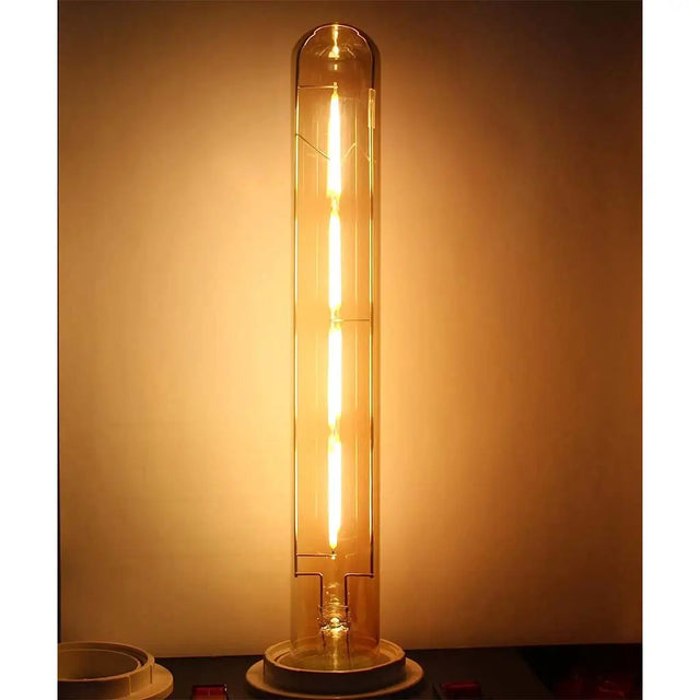 Vintage-style light bulb with a warm glow on a dark background