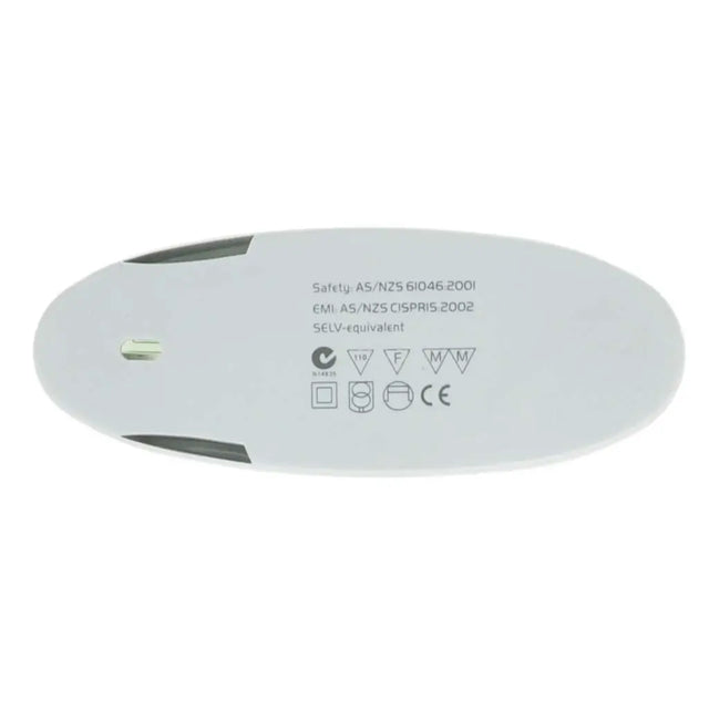 Round white device with safety certification labels on a white background