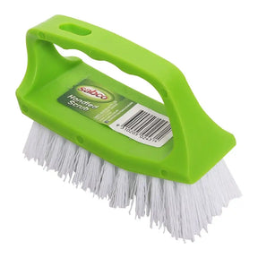 Green scrub brush with white bristles on a white background