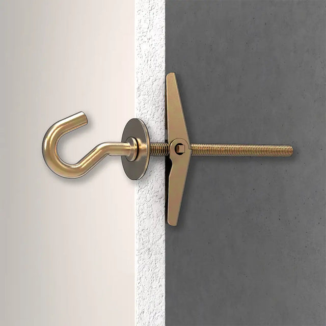 Gold hook and toggle on a white and gray wall