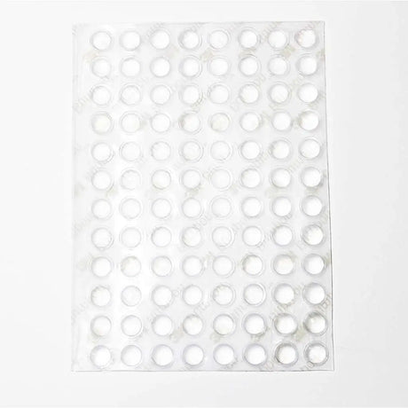 White pegboard with circular holes on a white background
