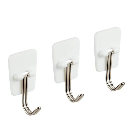 Three white hooks with metal hooks on a white background