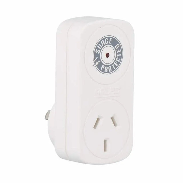 White electrical outlet with surge protector label on a white background