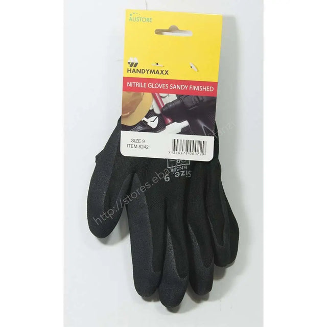 A pair of black nitrile work gloves with sandy textured palms and fingers, attached to a yellow and white retail hanger card. The card features the brand name 'Handymaxx' and the text 'Nitrile Gloves Sandy Finished'.