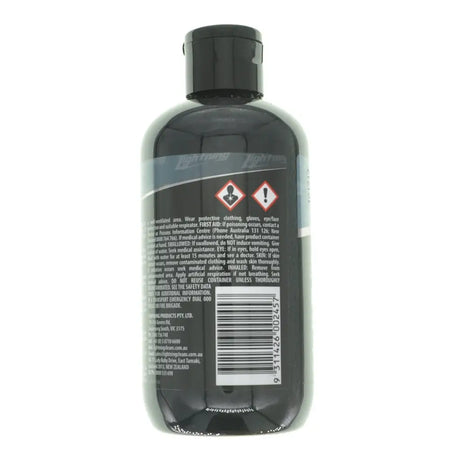 Black bottle with label and warning symbols on a white background