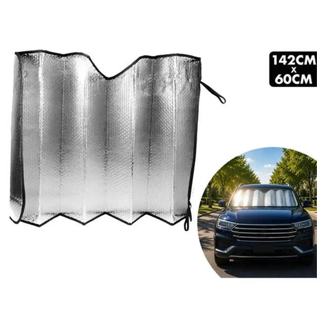 A silver reflective car sun shade shown flat on a white background, with a black size label reading 142CM x 60CM and a circular inset photo of the sun shade installed on a car.