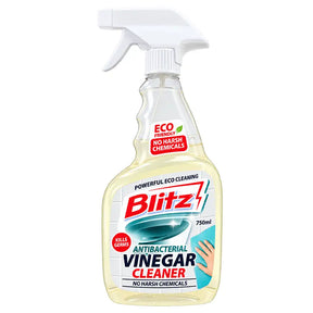 A 750ml spray bottle of Blitz Antibacterial Vinegar Cleaner on a solid white background. The bottle is made of transparent plastic filled with a pale yellow liquid, featuring a white trigger spray cap and a detailed label with red, blue, and white graphics.