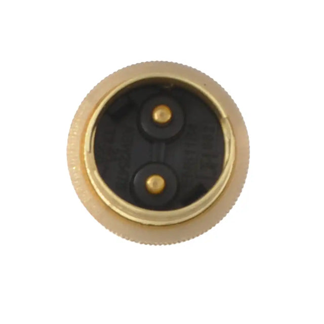 Brass fitting with black interior on a white background